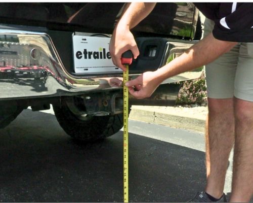 Measure trailer hitch height to top of receiver opening